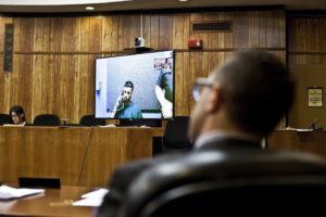 Inmate attending bail hearing via teleconference in Passaic County Courthouse. Photo by Bryan Anselm for the Wall Street Journal
